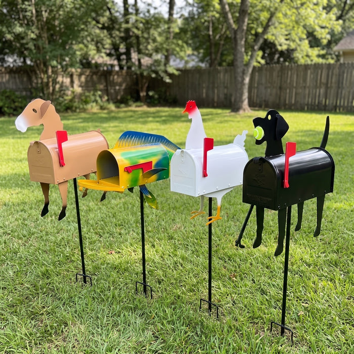 All four animal mailboxes on ground stakes in a yard